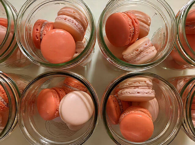 colorful macarons in glass cups
