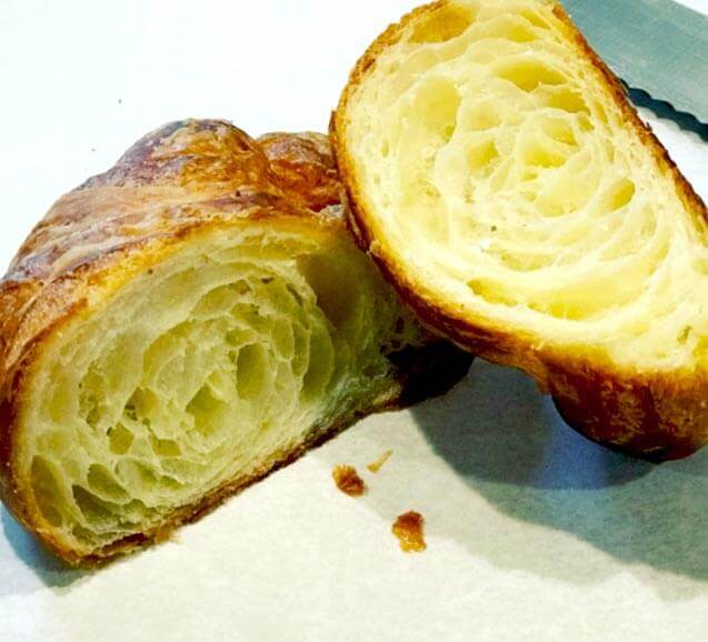 lacquered croissant sliced in half