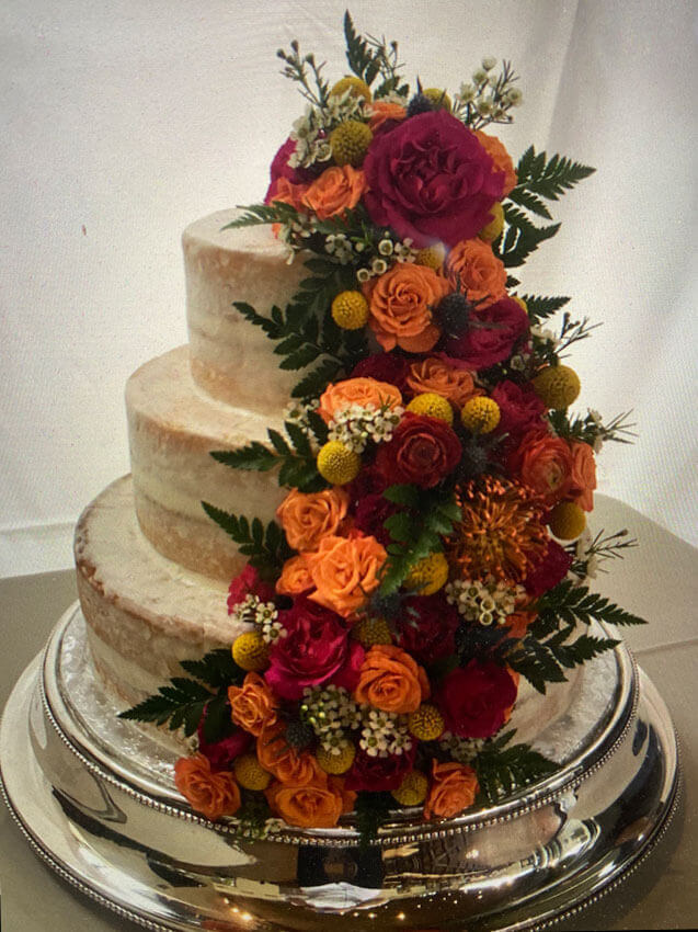 layered wedding cake with gumpaste flowers