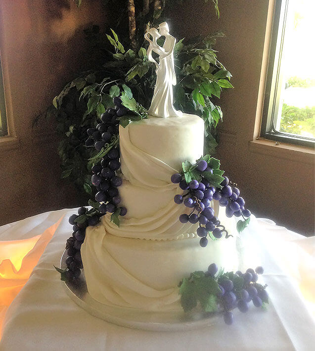 layered white wedding cake couple decoration