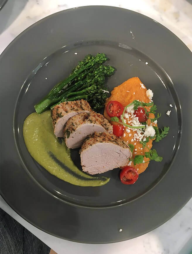 Chile-rubbed pork tenderloin with chipotle tomato polenta and sauce verde