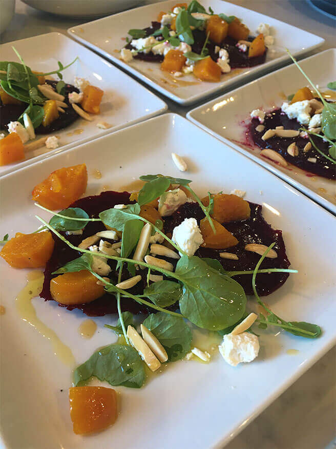 Roasted beet salad with white peach balsamic microgreens and burrata cheese