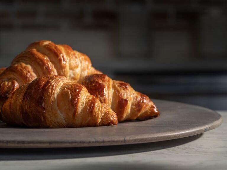 Croissants on a wooden plate