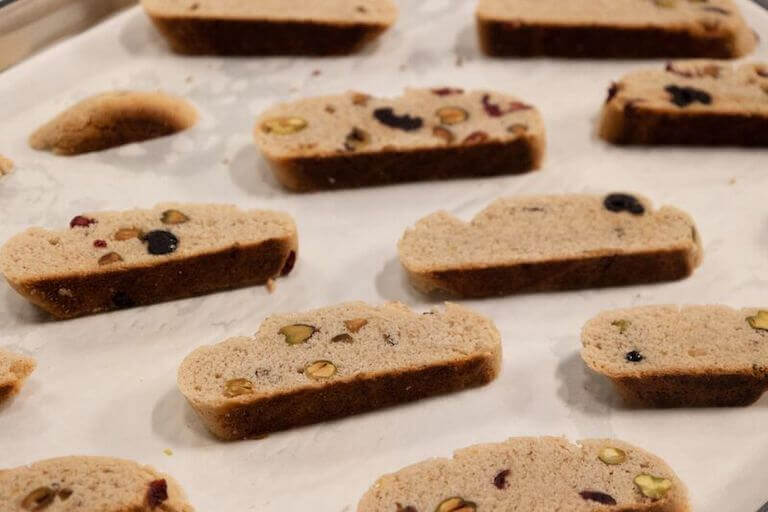 Fresh biscotti sitting on a tray after being baked