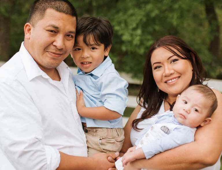 Katie Sualog and her family pose for a photo