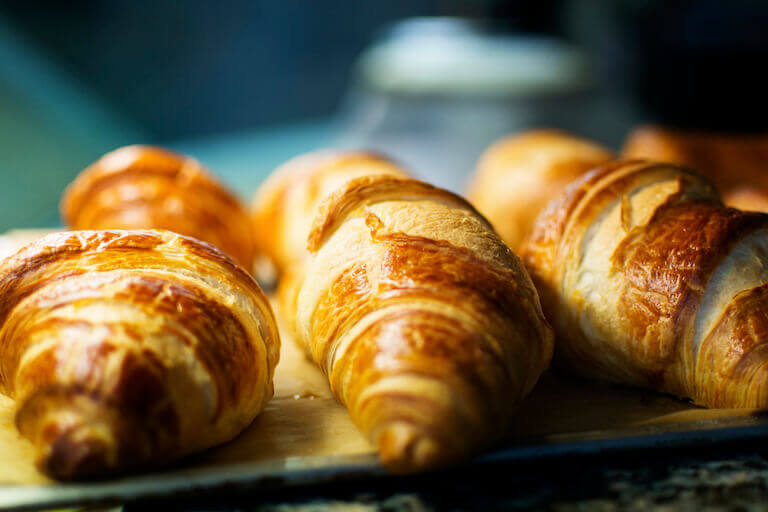 close up photo of fresh Croissants on a table