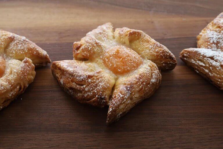 viennoiserie oranais puff pastry on a wooden table