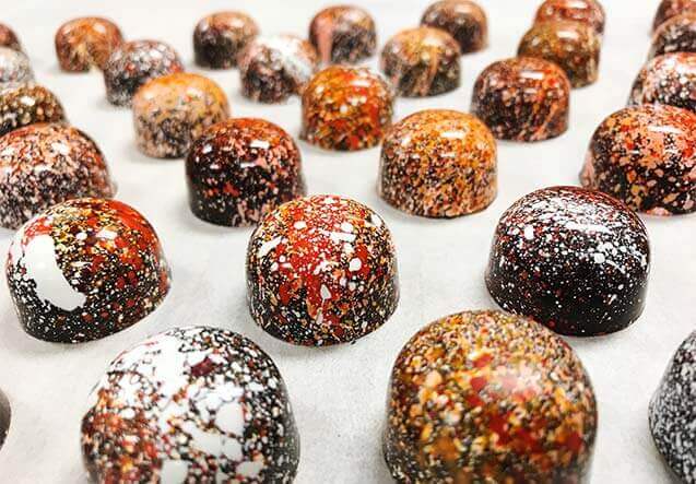 chocolate bon bons with decorative splatter