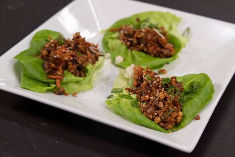 Lettuce cups on a white plate