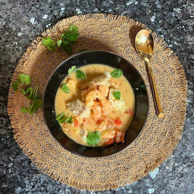 Bahian seafood stew with shrimp in a black bowl 