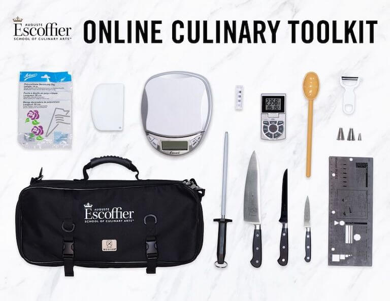Knife, spoon, and other tools included in the online culinary toolkit laying on a counter