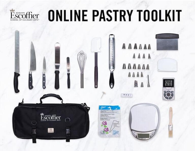 Knife, whisk, and other tools included in the online pastry toolkit laying on a counter