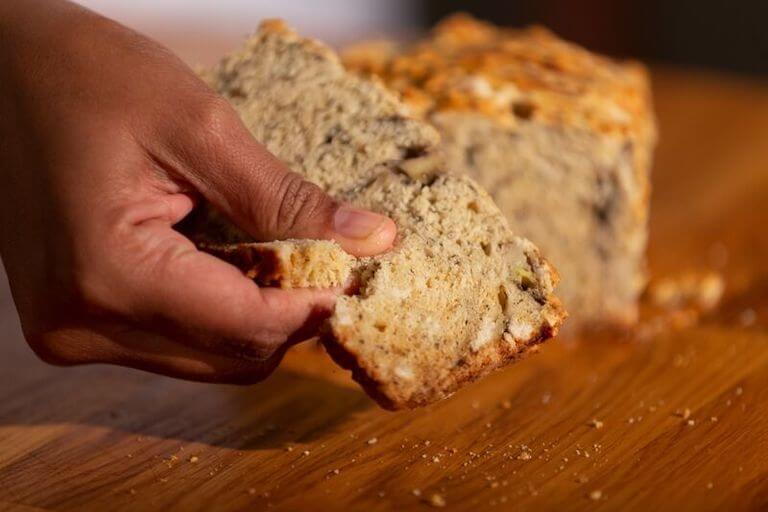 Chef's hand holding banana bread