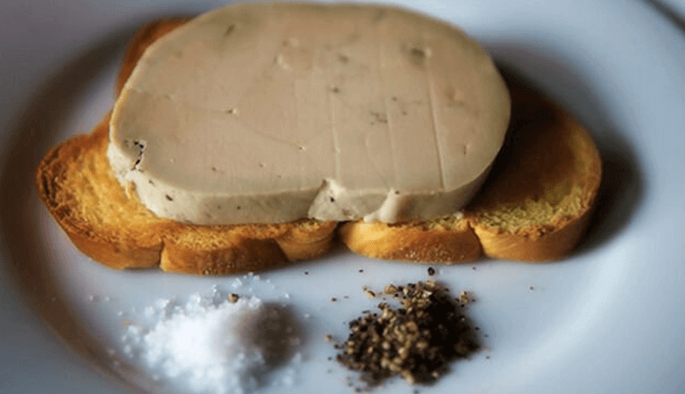 Foie gras torchon on a white plate