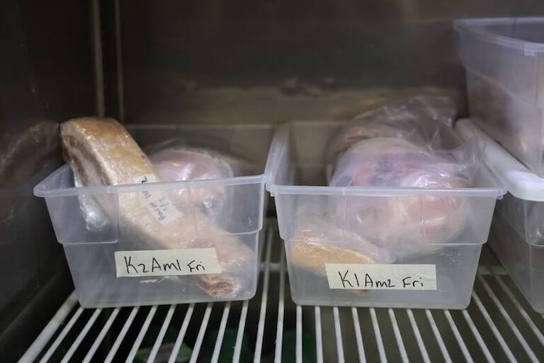 Fresh dough wrapped in plastic in plastic containers