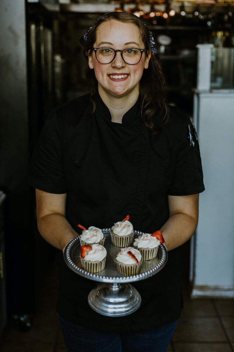 cassie wallace holding cupcakes