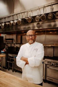 Kirk Bachmann, Escoffier Boulder campus president and host of The Ultimate Dish Podcast in the campus kitchen