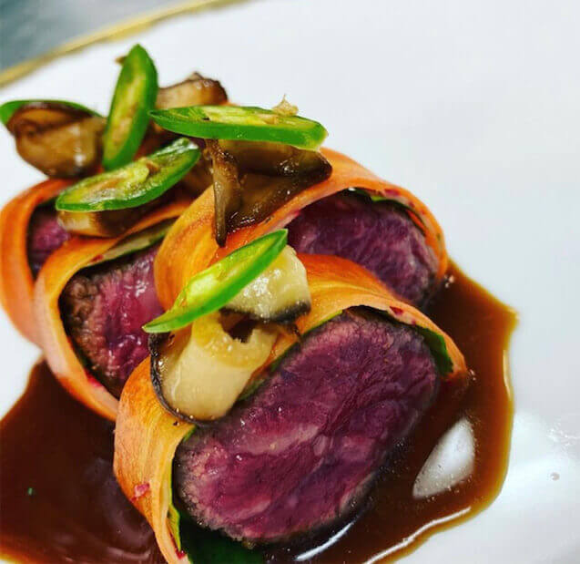 The Waygu wrap - pickled carrots, basil, braised shiitake, jalapeno and spiced demi glac