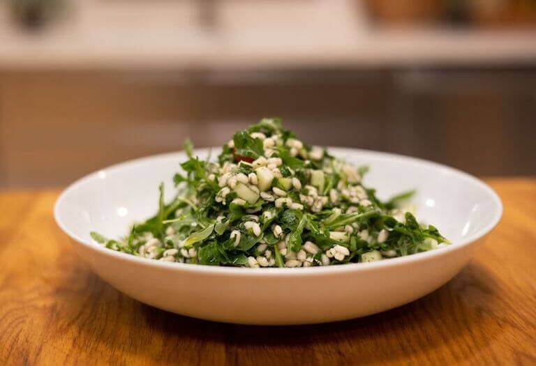 Grain salad in a white bowl