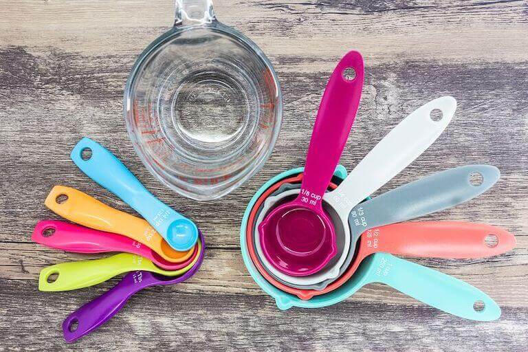 Colorful measuring cups and spoons on a table