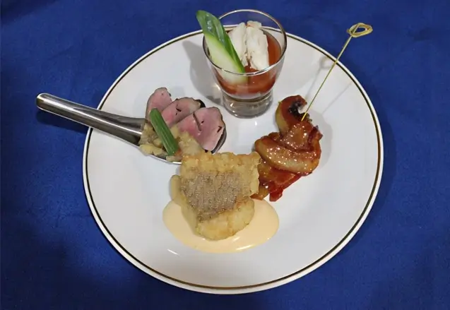 Sampler Platter of Fried Catfish, Seared Duck breast, Maple Bacon Knot, and Lump Crab Shooter