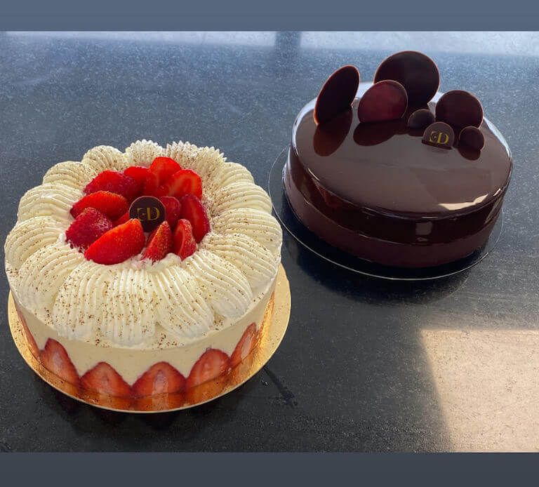 A strawberry cake and a chocolate cake made by Suhalia