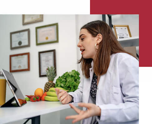 Nutritionist uses a digital tablet to conduct an online consultation with her patient