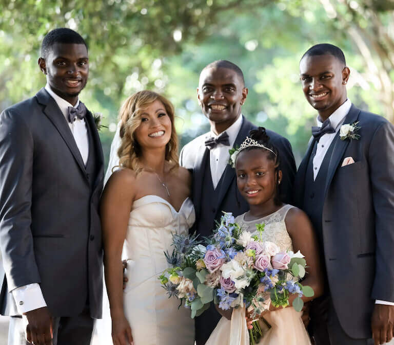Suhalia with her husband and stepchildren on her wedding day