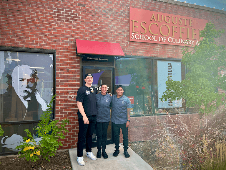 Chef Maggie, Jackson, and sous chef Santiago Hernandez posing for a photo outside of Escoffier’s Boulder Campus