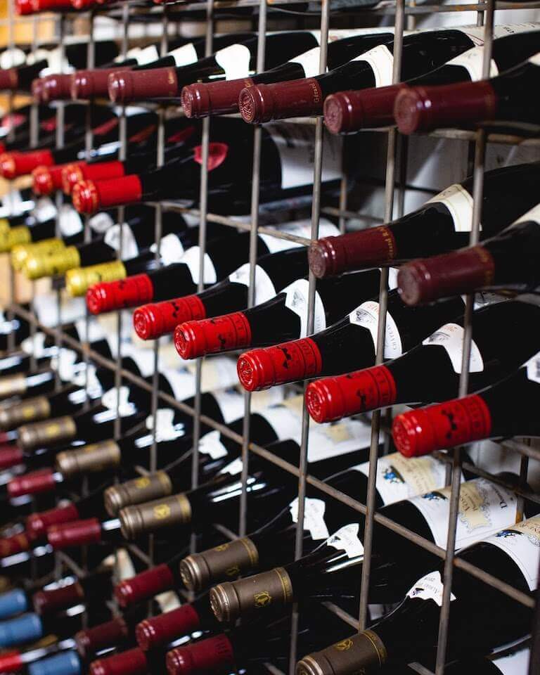 Rows of wine bottles on a wine rack