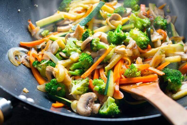 Stir fry with vegetables in a wok