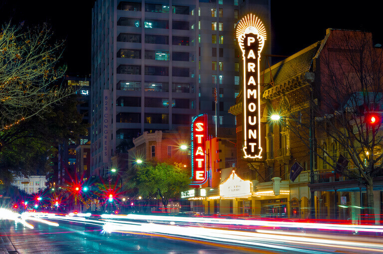 A long exposure image of the Paramount and State theaters in Austin.