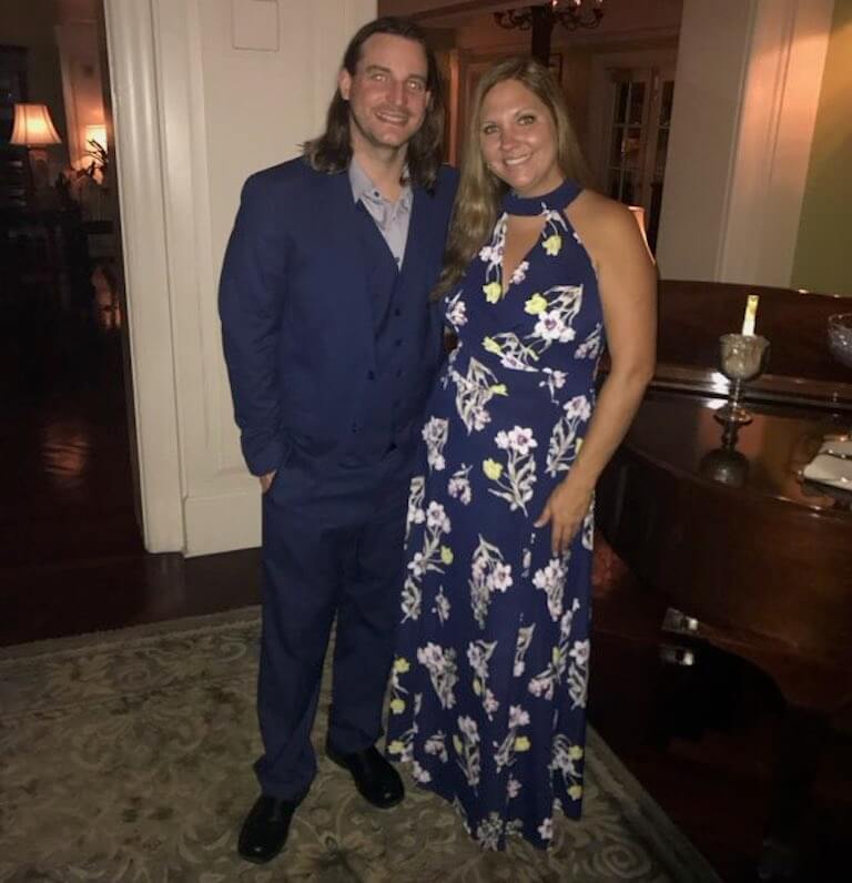 Chef Gregory and his wife pose in formal attire.