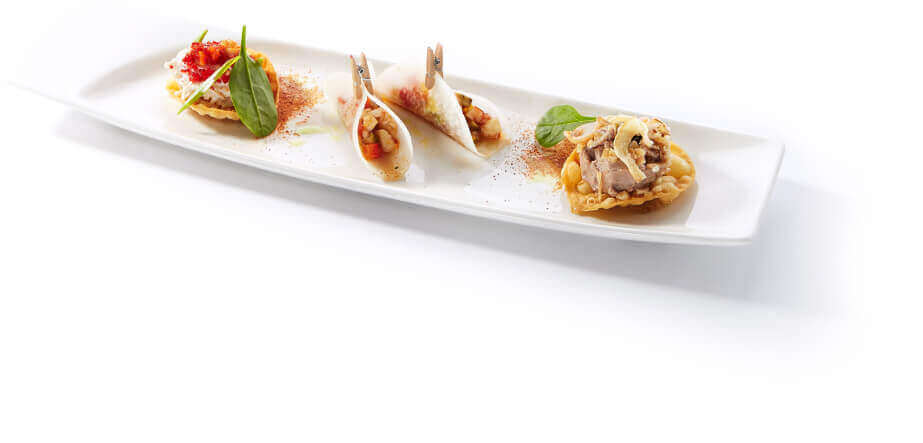 Three gourmet appetizers on a white serving plate