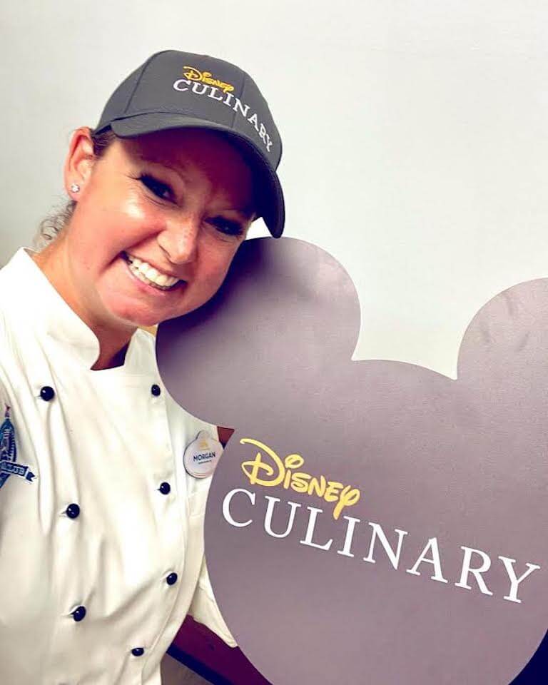 Morgan Banno poses by the Disney culinary logo.