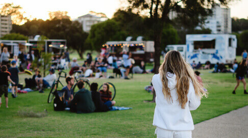 An outdoor food festival with food trucks