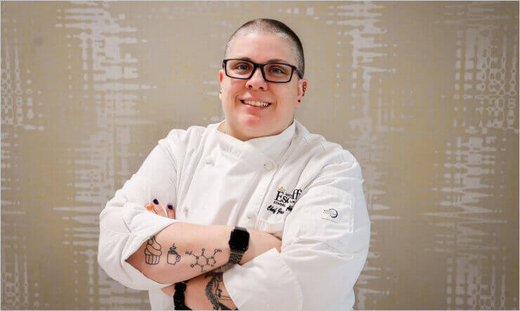 Escoffier Chef Instructor Jackie Abril-Carlile smiling at the camera