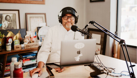 kirk bachmann, host of The Ultimate Dish Podcast, sitting at his desk