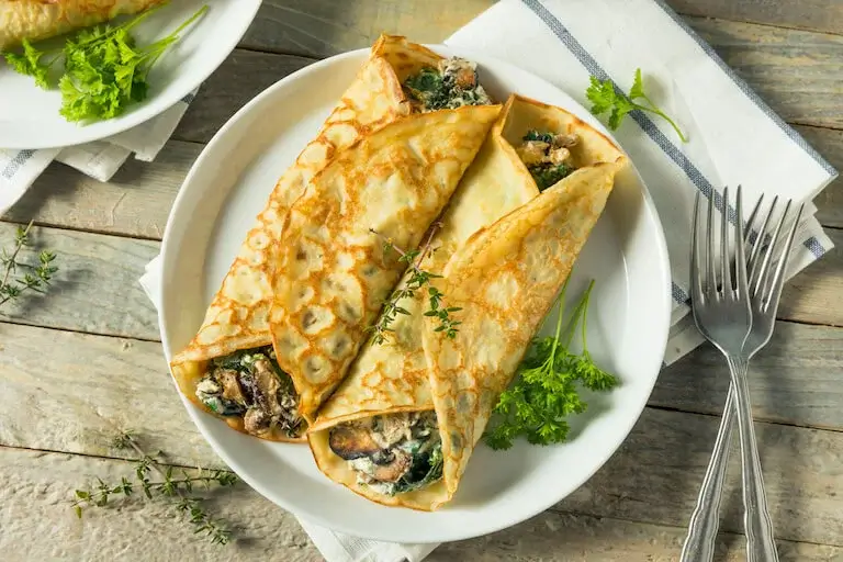 Savory Homemade Mushroom and Spinach Crepes.