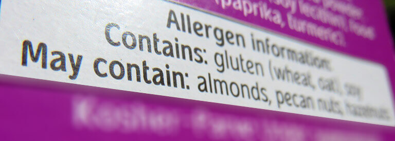A closeup view of an allergen statement on a food label.