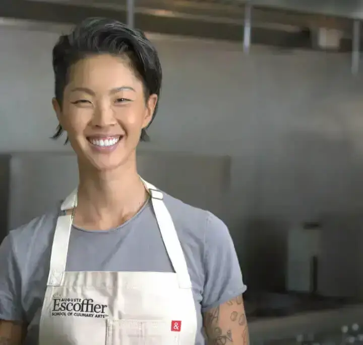 Kristen Kish wearing escoffier apron