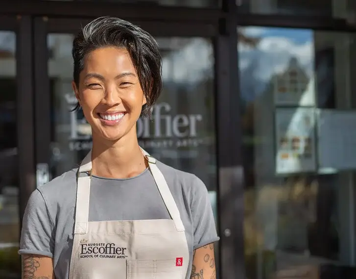 Escoffier Chef-in-Residence Kristen Kish standing outside the Escoffier Boulder campus