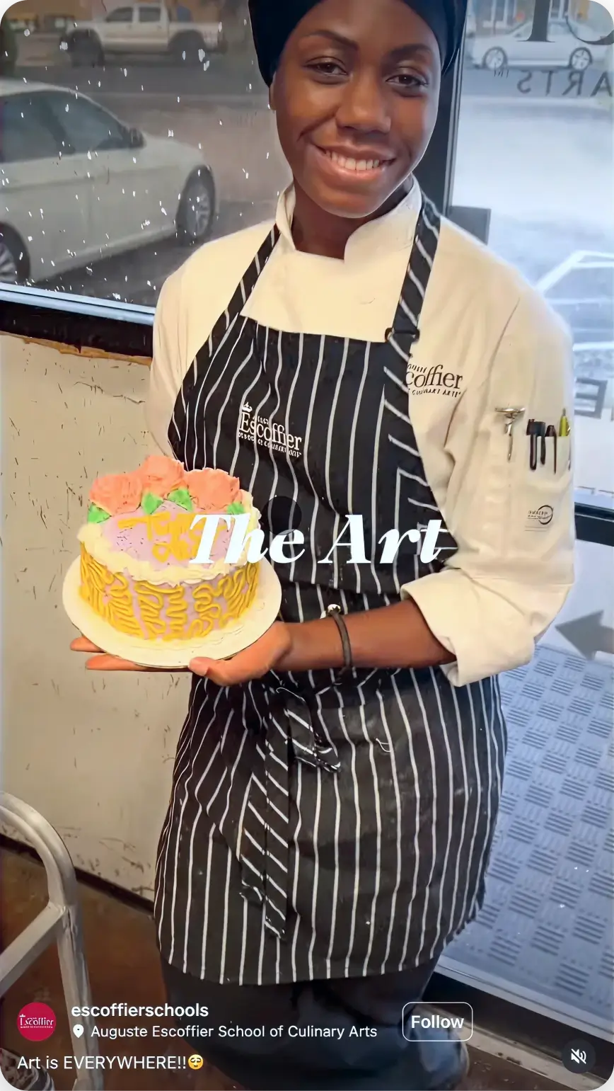 Escoffier culinary student proudly displaying a decorated basket weave cake with floral frosting details