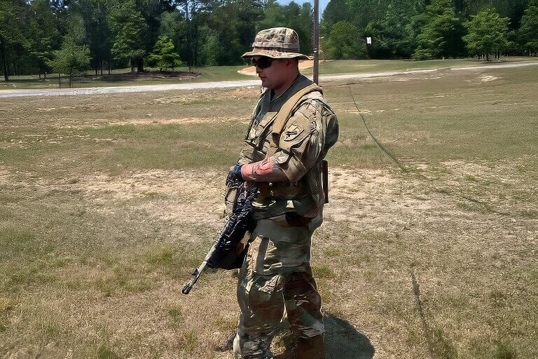 Richard Hodgkiss in U.S. Army uniform walking during military service.