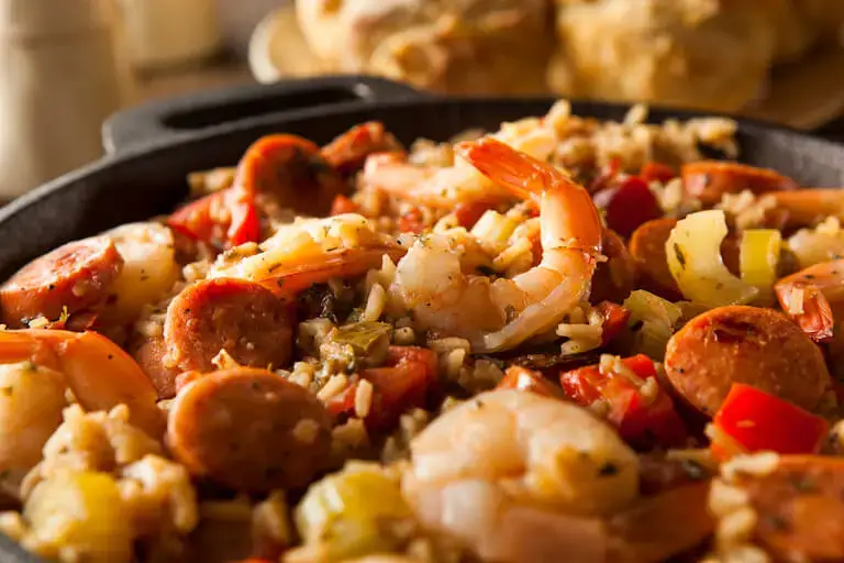shrimp and sausage jambalaya with visible onion, celery, and bell pepper pieces
