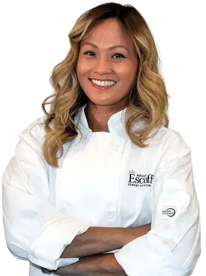 Escoffier graduate Suhalia Gant wearing Escoffier chef coat