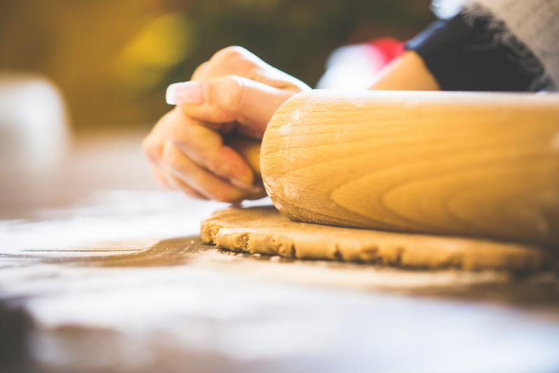 Roll out circles of dough to fill with cheese and egg.