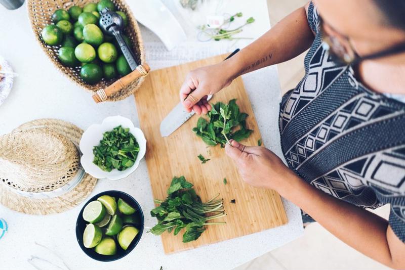 Chopping fresh herbs.