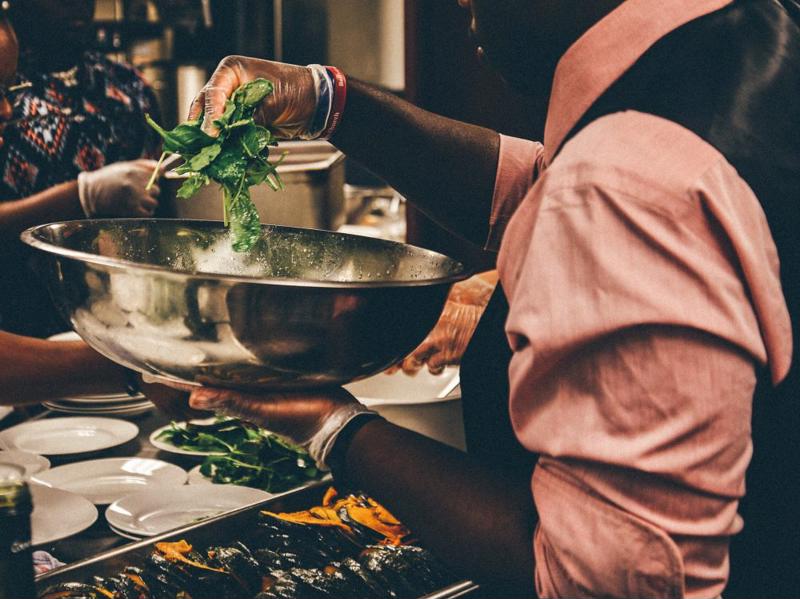 Chef preparing a salad.