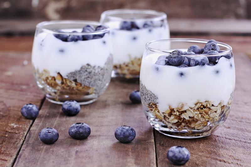 A group of yogurt, oat and berry parfaits.